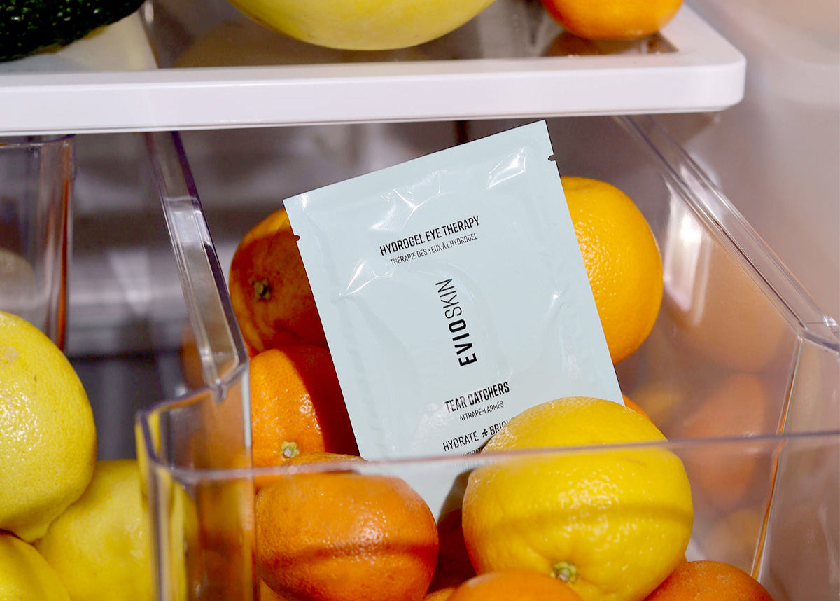 Hydrogel Eye Therapy surrounded by oranges to signify that it's made with Vitamin C