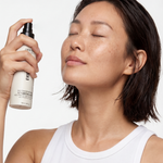 Model misting face with Stress Test Daily Repair Spray