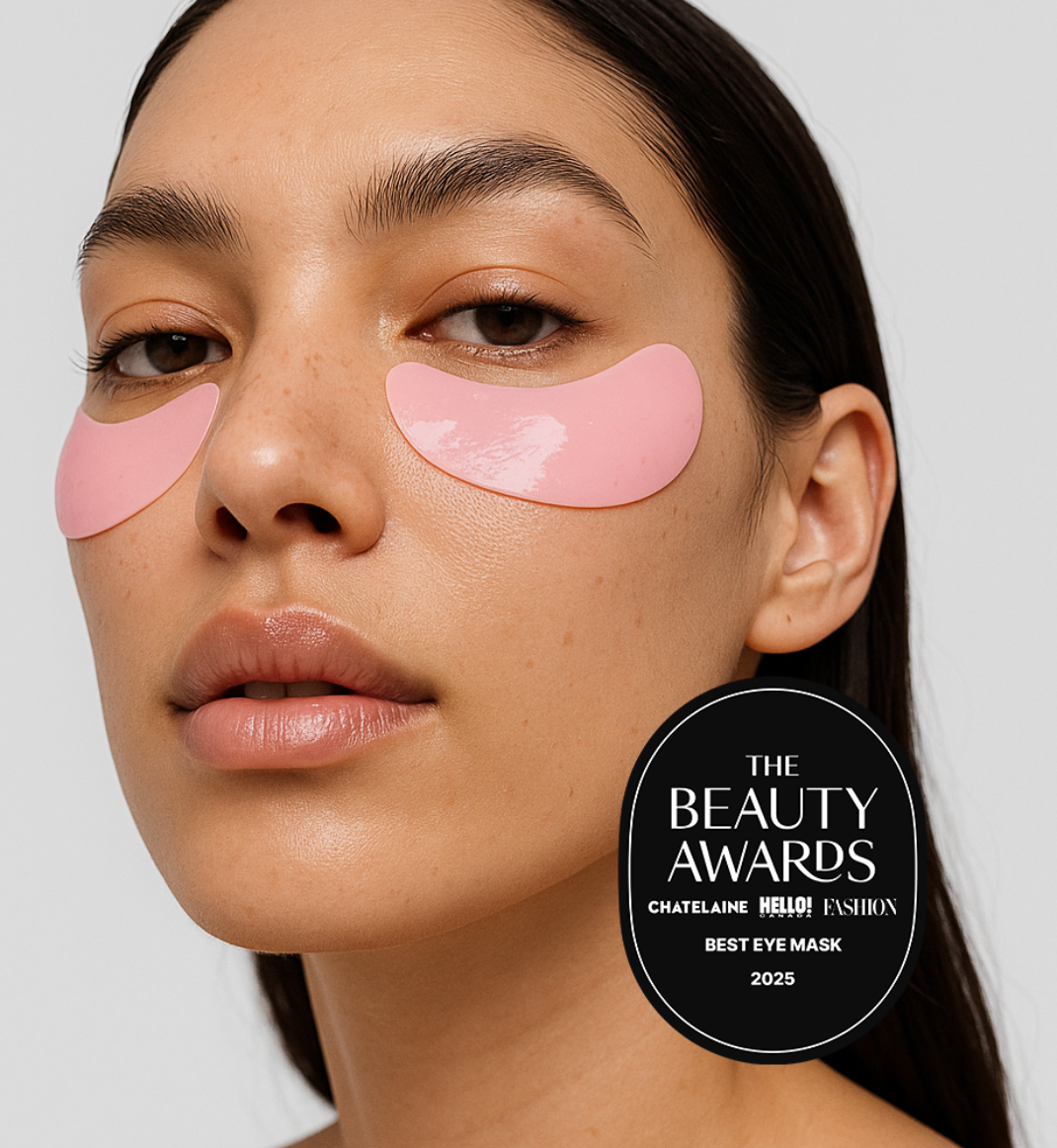 Woman wearing pink eye masks with 'The Beauty Awards' logo on a white background